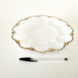 French white opaline or milkglass plate with scalloped edges and gold rim for serving eggs circa 1960 round plate for twelve eggs France
