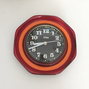 Beautiful vintage ceramic orange and red wall clock made by Extend in Germany in the 1970s