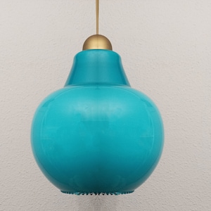 May include: A turquoise glass pendant light with a gold metal top.