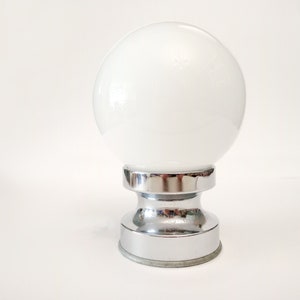 Space Age chrome table lamp with a white glass globe circa 1960 Small Mid century table lamp with glass shade from Spain