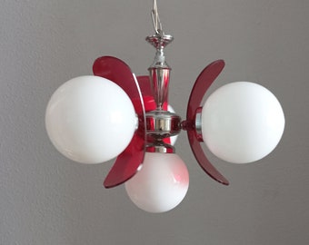 Atomic sputnik chrome and clear red lucite pendant light with four white globes circa 1960 Space age red plexiglas and chrome light Mcm lamp