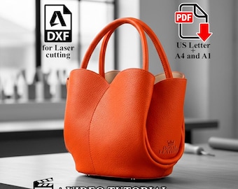 Puede incluir: Un bolso de mano de cuero naranja con dos asas. El bolso tiene una forma única y una superficie texturizada. La imagen incluye el texto "DXF for Laser cutting", "US Letter + A4 and A1", y "+ VIDEO TUTORIAL".