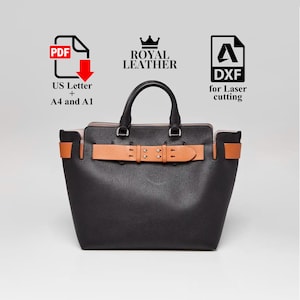 Peut inclure: Sac fourre-tout en cuir noir avec ceinture et poignées beiges. Le sac a un design structuré avec une poignée supérieure et une fermeture à boucle. Le texte "Royal Leather" est au-dessus du sac.