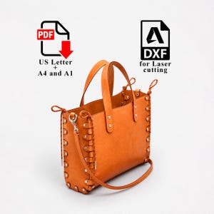May include: A tan leather tote bag with two top handles and a detachable shoulder strap. The sides feature a woven lacing detail with silver-tone metal rivets. Text icons indicate PDF US Letter, A4, A1, and DXF for laser cutting files.