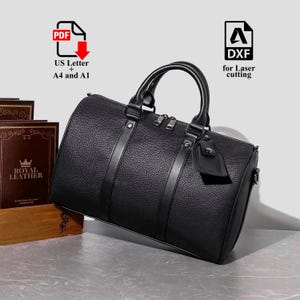 May include: Black leather duffel bag with top handles, a detachable tag, and silver-tone zips. The bag has a textured surface and vertical leather straps. The image also includes text that says "US Letter + A4 and A1" and "DXF for Laser cutting".
