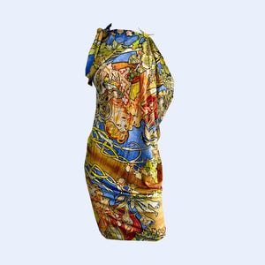 May include: A colourful, patterned dress with a blue, yellow and orange design. The dress has a one-shoulder style and a fitted silhouette.