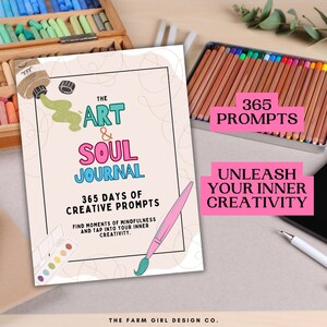 May include: A pink and white journal cover with the text "The Art & Soul Journal" and "365 Days of Creative Prompts". The cover also features a paintbrush, paint tube, and a colorful palette.
