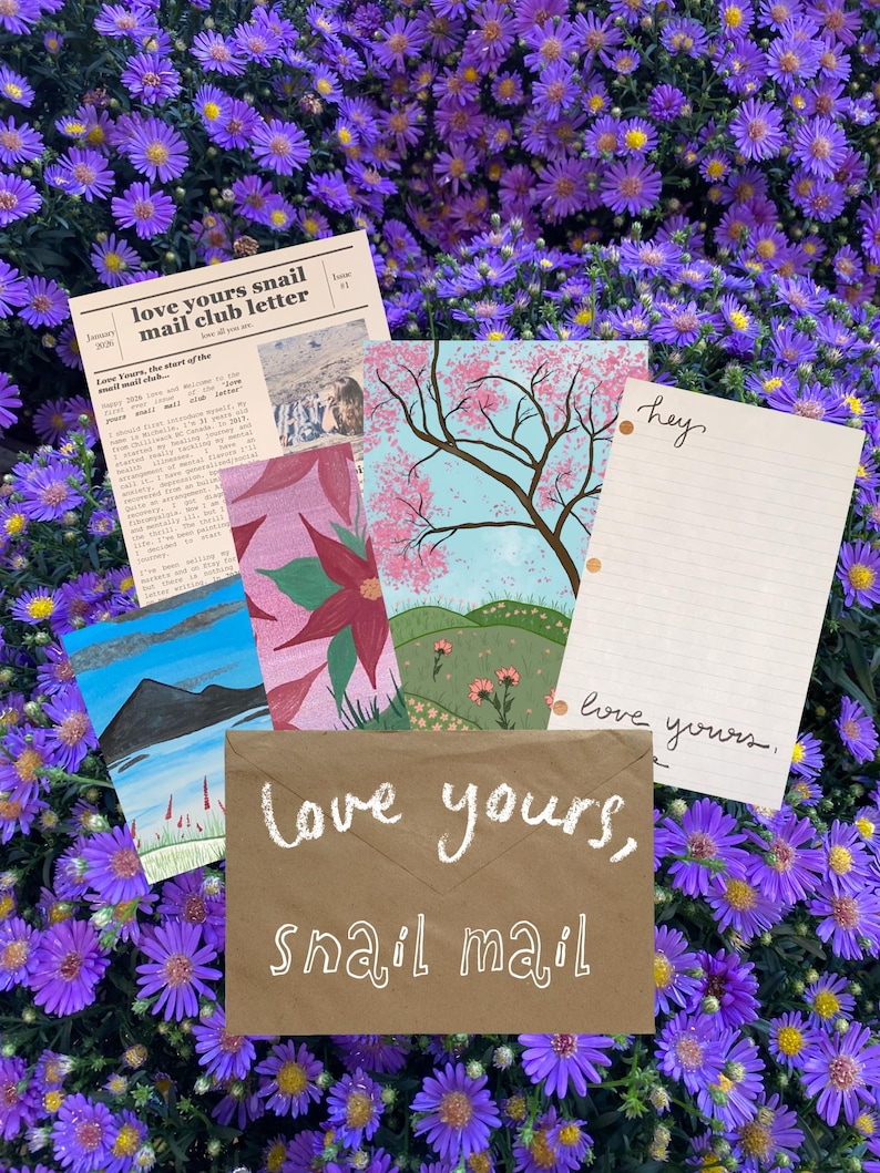 May include: A collection of stationery items including a brown envelope with the text "love yours, snail mail" in white, a "love yours snail mail club letter" newsletter, a lined "hey" note, and two illustrated cards featuring a tree and landscape.