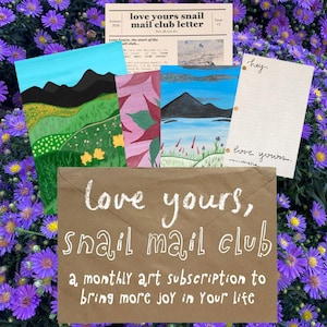 May include: A brown paper envelope with the text love yours, snail mail club, a monthly art subscription to bring more joy in Your life, accompanied by a newsletter, three illustrated art prints, and a lined stationery sheet with the text hey.