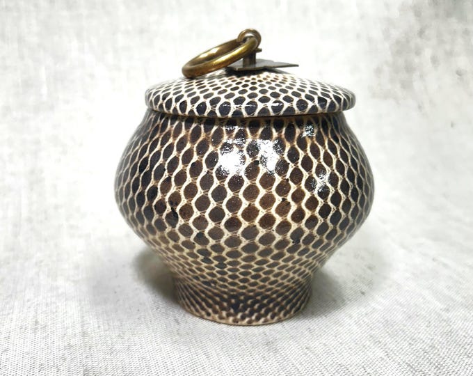 Ornate handmade ceramic container with a brass tone metal handle | HOME DECOR