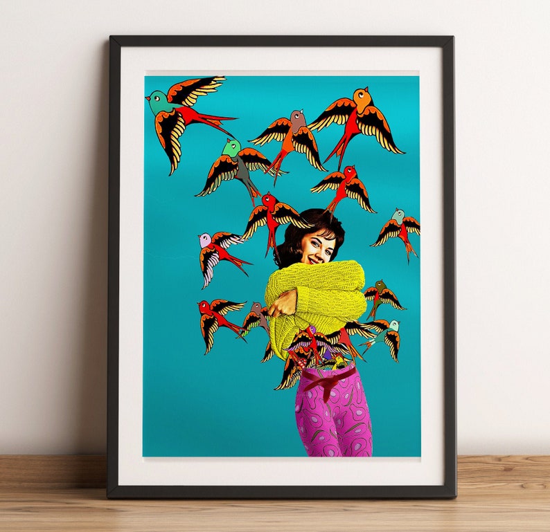 May include: A woman in a yellow sweater and pink pants stands against a turquoise background. She is surrounded by colorful birds with red, orange, yellow, green, and blue accents.