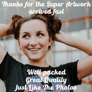 May include: A smiling woman with her hair in two buns, wearing a black t-shirt with the text "Thanks for the Super Artwork arrived fast Well packed Great Quality Just Like The Photos" printed on it.