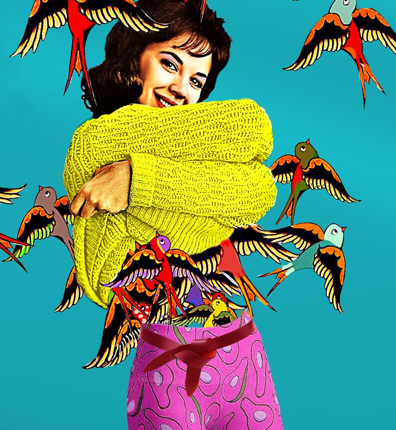 May include: A woman wearing a yellow sweater with a pink skirt with an avocado pattern. The sweater is covered in colorful birds with black outlines.