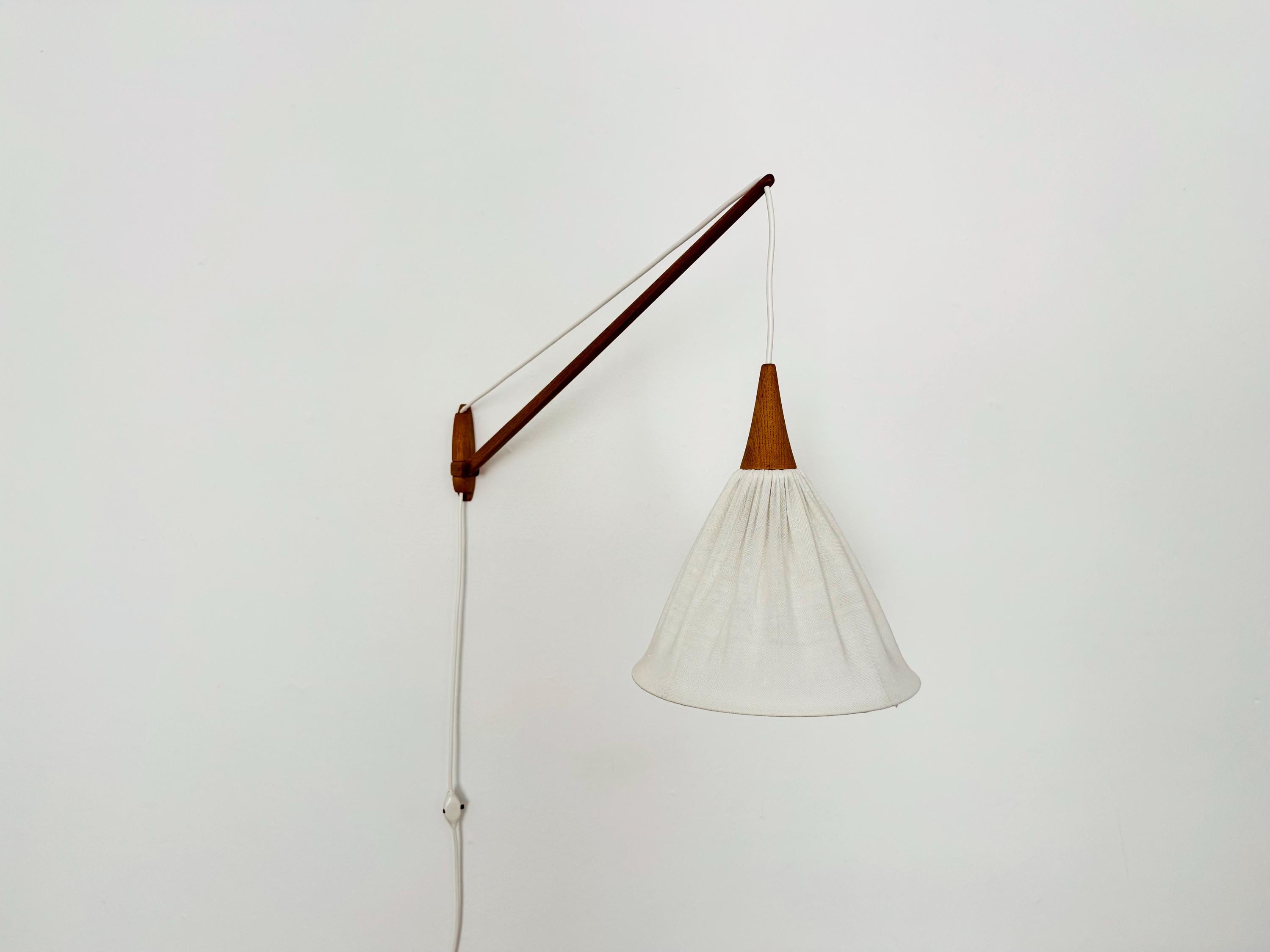 Danish Adjustable Mid-Century Modern Oak Wall Lamp by Uno and Östen Kristiansson | 1960s