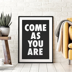 May include: Black and white framed print with the text "COME AS YOU ARE" on a black background.