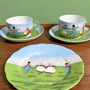 Dutch scene porcelain cup & saucer, side plate, hand painted scene of Dutch children playing by windmill and water, available individually