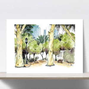 May include: A watercolor illustration of a city park scene with tall buildings in the background, trees, a lamppost, and a bench. The trees are drawn in shades of green and brown, and the buildings are drawn in shades of blue and gray.