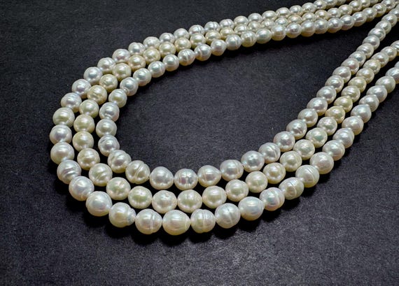 AAA White Baroque Freshwater Pearl Strand - 6mm Roundish Beads