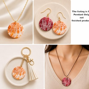 May include: A collection of jewelry pendants and accessories. The pendants have a circular design with orange and white patterns. The image includes a necklace, earrings, and a keychain with a tassel. The text in the image says "The listing is for Pendant Only, not finished product."
