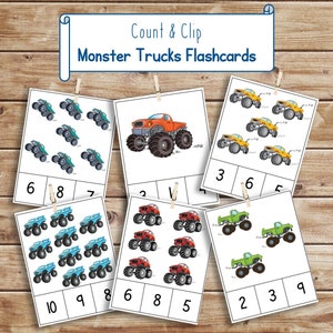 May include: A set of printable monster truck flashcards for kids to count and clip. The cards feature different colored monster trucks with numbers to count and clip.