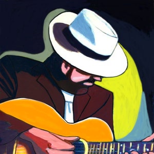 May include: A man wearing a white fedora plays a yellow acoustic guitar. The guitar has a dark brown neck and a dark brown fretboard. The man is wearing a brown jacket and a white shirt.