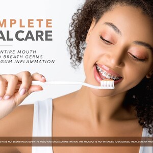 May include: A woman with braces smiles while brushing her teeth with a white toothbrush. The text "COMPLETE ORAL CARE" is at the top of the image. The text "CLEANS ENTIRE MOUTH KILLS BAD BREATH GERMS REDUCES GUM INFLAMMATION" is below the title. The text "THESE STATEMENTS HAVE NOT BEEN EVALUATED BY THE FOOD AND DRUG ADMINISTRATION. THIS PRODUCT IS NOT INTENDED TO DIAGNOSE, TREAT, CURE OR PREVENT ANY DISEASE." is at the bottom of the image.