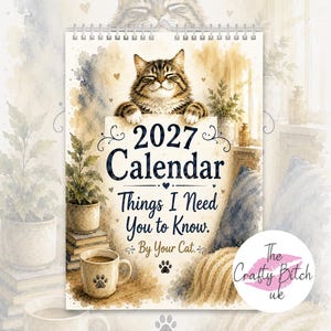 May include: A 2027 wall calendar with a spiral binding featuring a watercolor illustration of a tabby cat. The text reads 2027 Calendar, Things I Need You to Know. By Your Cat. The design includes a potted plant, a coffee mug, and paw prints.
