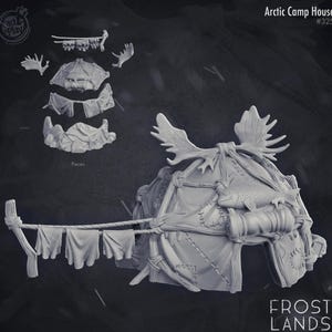 May include: A detailed, gray-toned miniature Arctic Camp House, featuring a tent-like structure adorned with antlers and a fish. The design includes separate pieces and a clothesline with hanging items. The text "Arctic Camp House #325" and "FROST LANDS" are visible.