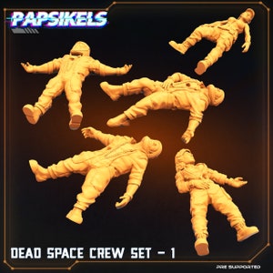 Puede incluir: Cinco figuras de tripulación espacial impresas en 3D en varias poses. Las figuras son de color amarillo y están posadas de forma dinámica. Las figuras están etiquetadas como "Dead Space Crew Set - 1" y "Pre Supported".