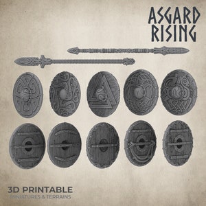 May include: A set of 3D printable shields and a spear, designed in a Viking style. The shields feature various intricate designs, including a knotwork pattern, a triangle with a circle inside, and a dragon. The spear has a long shaft and a pointed tip. The text "ASSGARD RISING" is printed in a bold font at the top of the image. The text "3D PRINTABLE MINIATURES & TERRAINS" is printed at the bottom of the image.