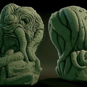May include: Two green sculptures of a creature with a large head, tentacles, and a textured surface. The creature has a prominent eye and a gaping mouth. The sculptures are set against a dark background.