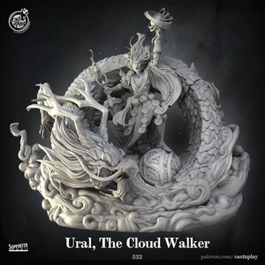 May include: A gray 3D printed miniature of a figure standing on a dragon, holding a sphere in one hand and a staff in the other. The figure is wearing a robe and has long hair. The dragon is curled around the figure and has wings. The base of the miniature is made of clouds. The text "Ural, The Cloud Walker" is printed below the miniature.