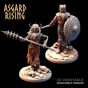 May include: Two 3D printed miniature figures of Norse warriors, one holding a spear and the other a shield. Both figures are wearing chainmail armor and have long beards. The figures are standing on circular bases.