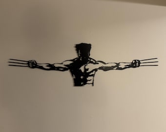 Wolverine metal sign coated black.
