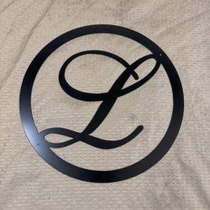 Metal letter L with circle
