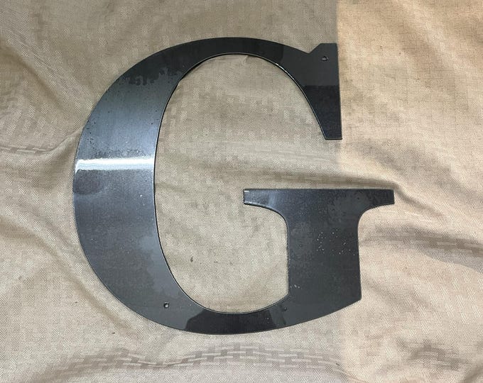 Metal letter G