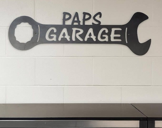 Metal paps garage wrench sign.