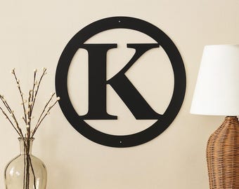 Metal letter K with circle