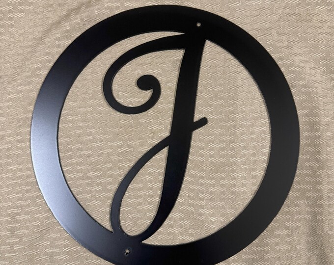 Metal letter J in circle