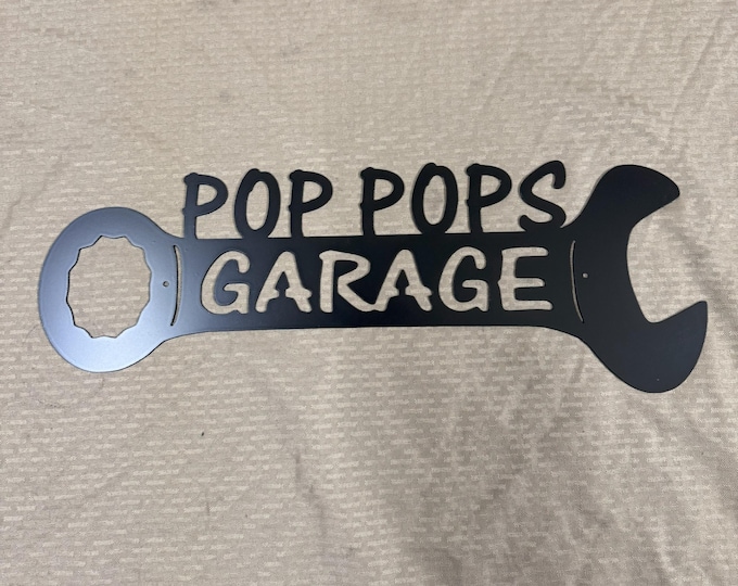 Metal pop pops garage wrench sign.