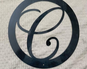 Metal letter C in circle