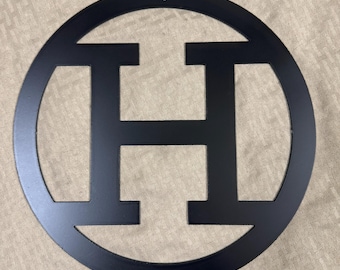 Metal letter H with circle