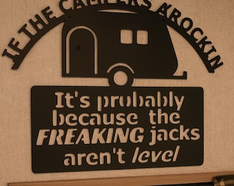 Metal sign ( if the camper’s a’rockin) sign.