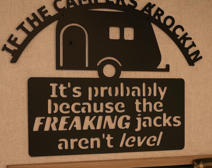 Metal sign ( if the camper’s a’rockin) sign.