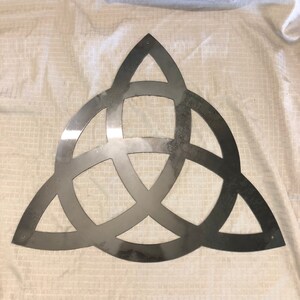 Industrial Rustic Metal triquatra sign. Cut from 14 gauge steel and clear coated.
