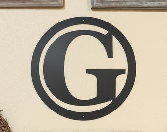 Metal letter G in circle