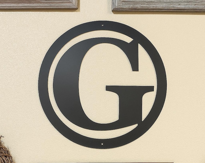 Metal letter G in circle