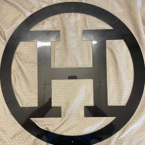 Metal letter H with circle