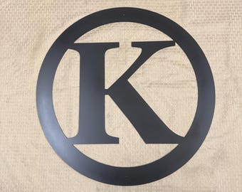Metal letter K with circle