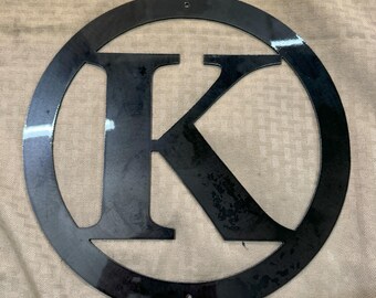 Metal letter K with circle